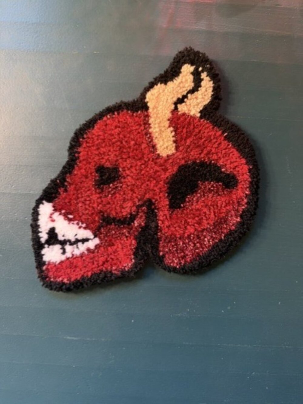 Handmade red devil carpet